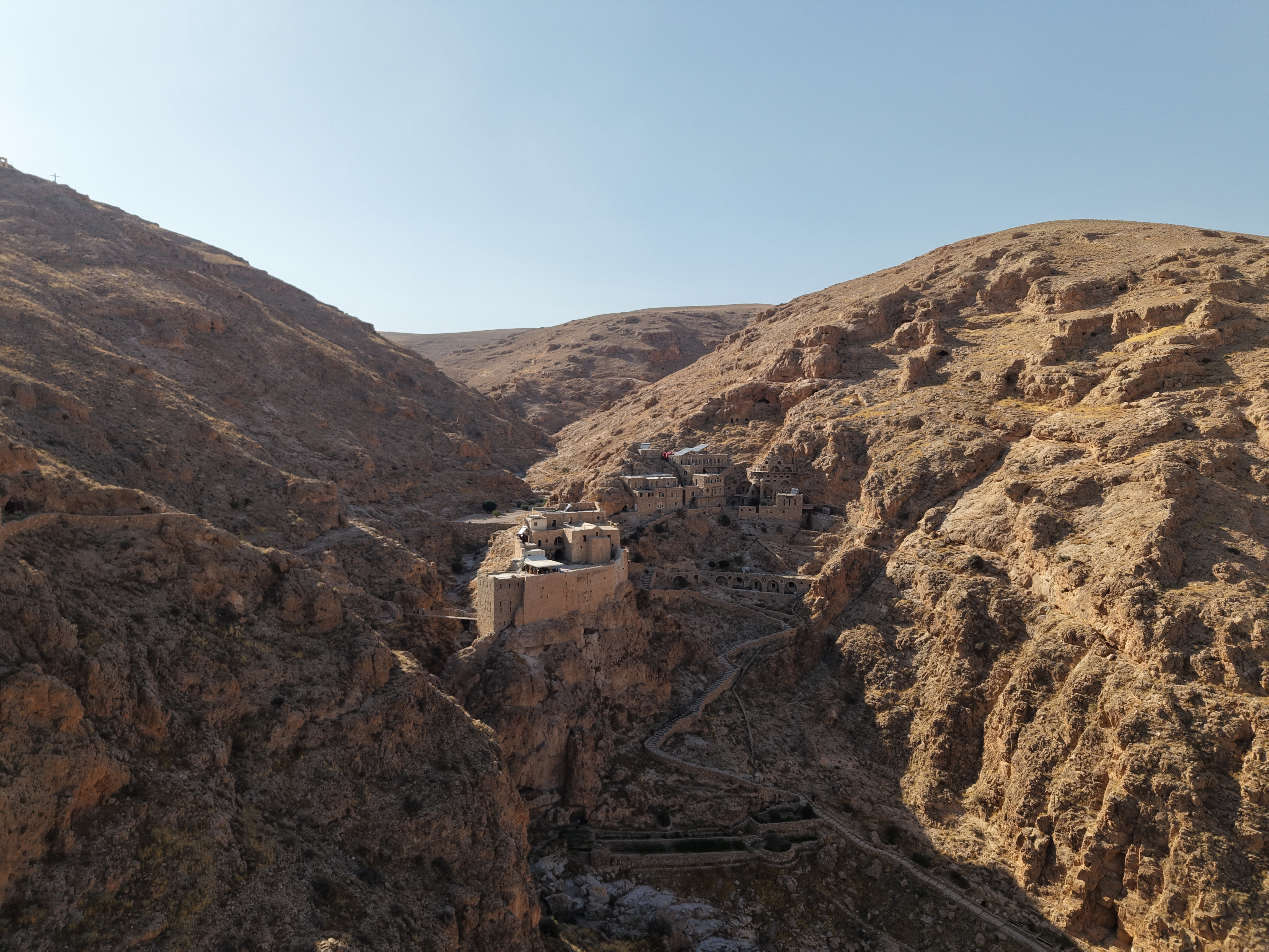 Deir Mar Musa monastery on its cliff in the Qalamoun desert